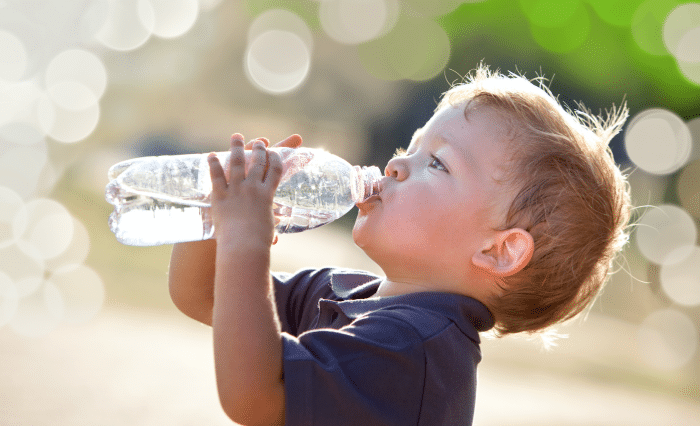 Child drinking bottled water