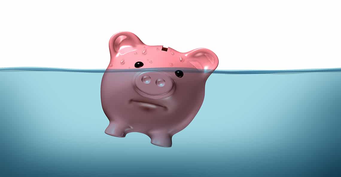 piggybank drowning in debt