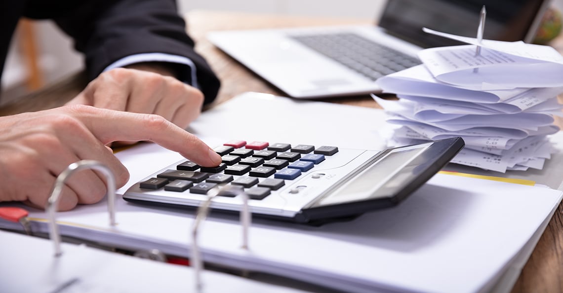 chartered accountant using a calculator