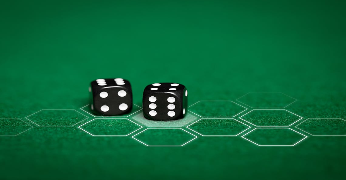 dice on green electronic table